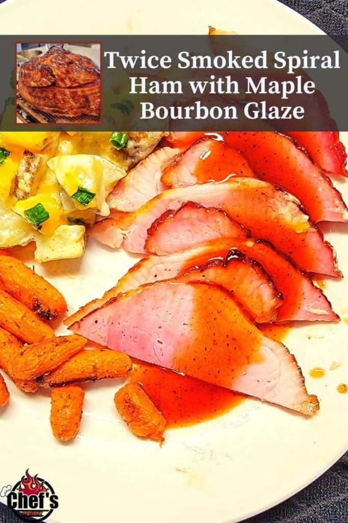 Sliced spiral ham with maple bourbon glaze on plate with potatoes and carrots